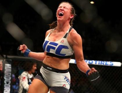 Miesha Tate celebrates her victory by submission against Holly Holm. (Reuters)