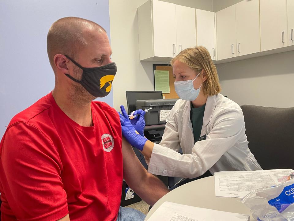 Hy-Vee pharmacist Carley Start administers a flu shot to Rick DeBruin at the Hy-Vee Westlakes location in West Des Moines on Tuesday, Sept. 21, 2022.