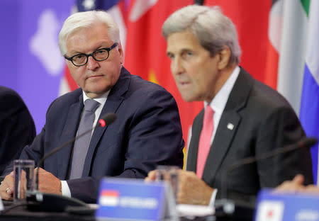 German Foreign Minister Frank-Walter Steinmeier (L) listens as U.S. Secretary of State John Kerry speaks during a Pledging Conference in Support of Iraq, co-hosted by the United States, Canada, Germany, Japan, Kuwait, and The Netherlands at the State Department in Washington, U.S., July 20, 2016. REUTERS/Joshua Roberts