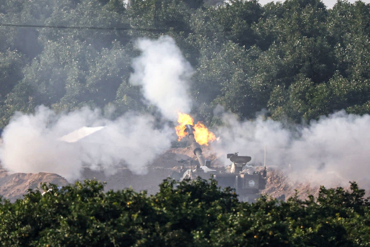 A tank in southern Israel fires into the Gaza Strip (AFP via Getty Images)