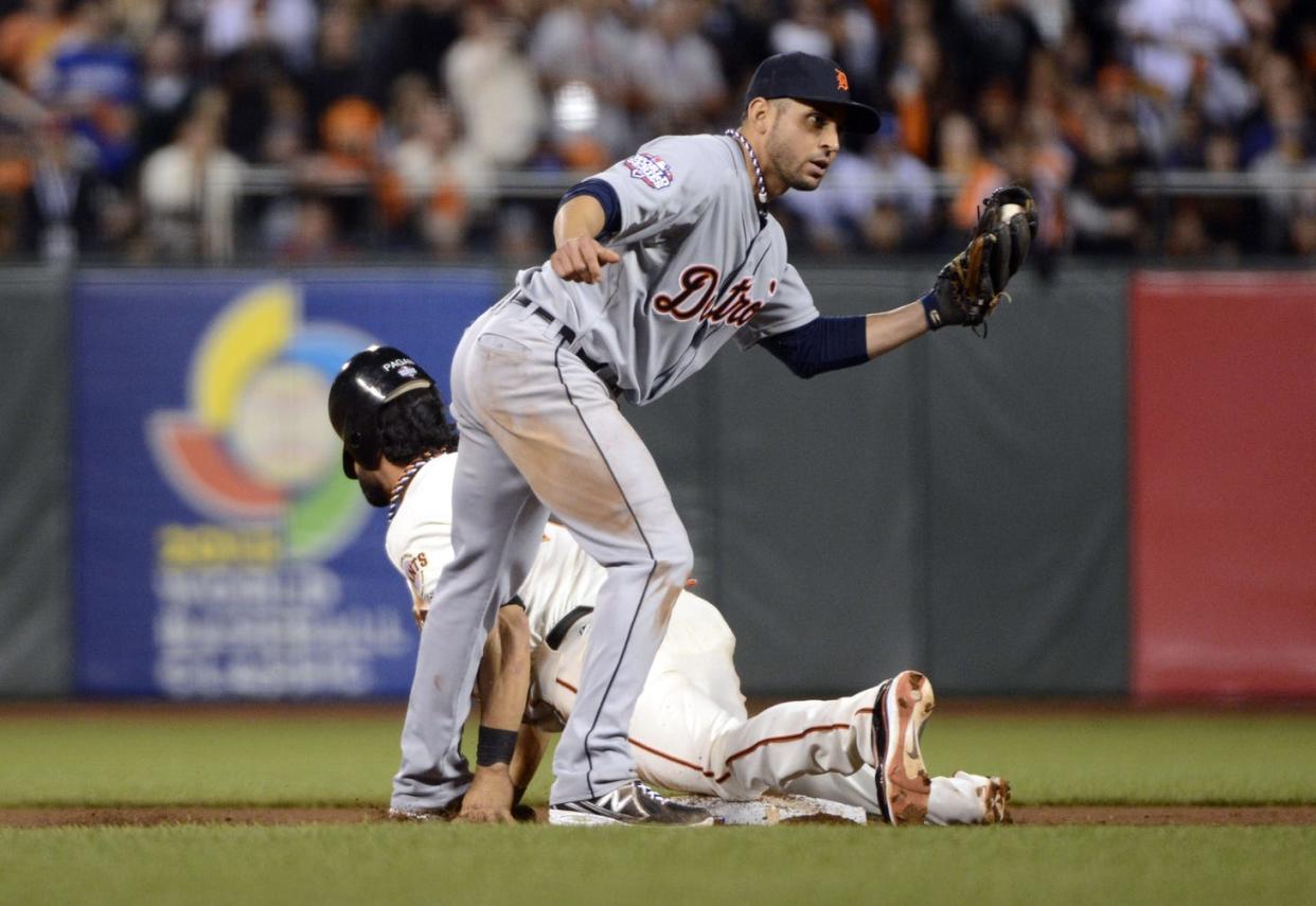 Oct 25, 2012; San Francisco, CA, USA; San Francisco Giants outfielder Angel Pagan (rear) steals second base ahead of the tag by Detroit Tigers second baseman Omar Infante in the 8th inning during game two of the 2012 World Series at AT&T Park. Mandatory Credit: H. Darr Beiser-USA TODAY Sports
