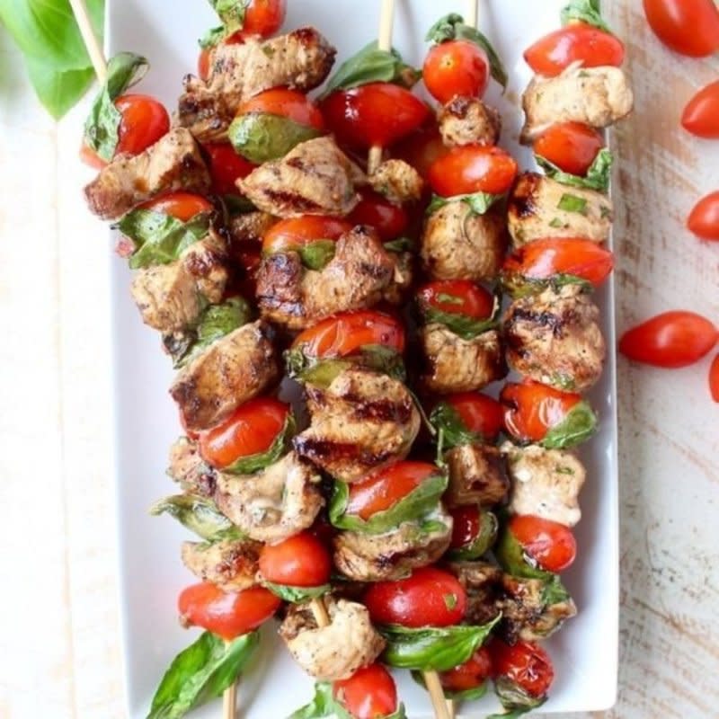 <p>Whitney Bond</p><p>These easy and delicious skewers are made with marinated chicken, cherry tomatoes & fresh basil for a healthy, gluten-free meal, made on the grill!</p><p><strong>Get the recipe:</strong><strong> <a href="https://whitneybond.com/tomato-basil-chicken-skewers/" rel="nofollow noopener" target="_blank" data-ylk="slk:Tomato Basil Chicken Skewers;elm:context_link;itc:0;sec:content-canvas" class="link ">Tomato Basil Chicken Skewers</a></strong></p>