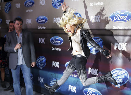 American Idol XIV finalist Jax jumps in the air during Fox's American Idol XIV Finalist Party at The District Restaurant in Los Angeles, California March 11, 2015. REUTERS/Jonathan Alcorn