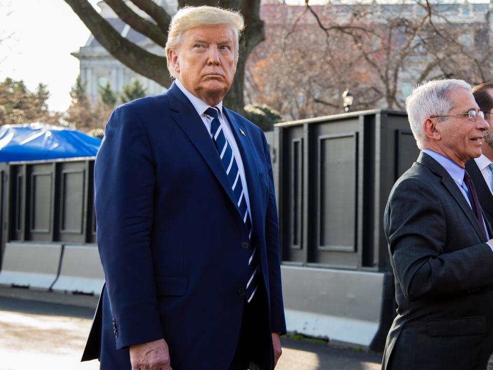 President Donald Trump with Director of the National Institute of Allergy and Infectious Diseases at the National Institutes of Health Anthony Fauci, center, and Department of Health and Human Services Secretary Alex Azar, speaks to reporters on the South Lawn, Tuesday, March 3, 2020, in Washington, as they arrive at the White House from a visit to the National Institutes of Health's Vaccine Research Center in Bethesda, Md. (AP Photo/Manuel Balce Ceneta)