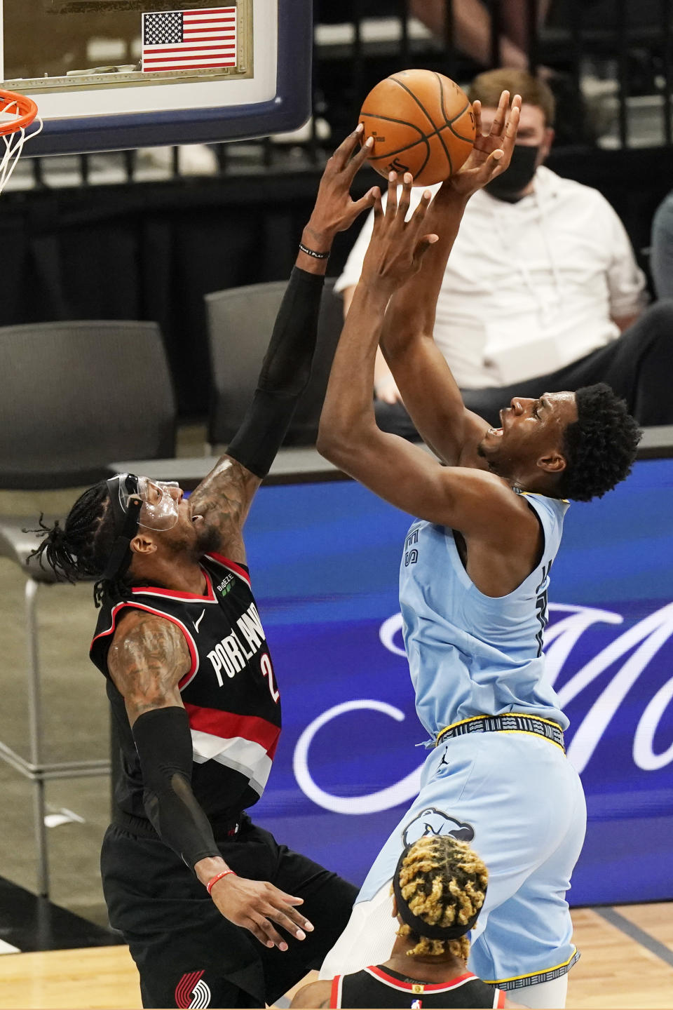 Memphis Grizzlies' Jaren Jackson Jr., right, drives against Portland Trail Blazers' Rondae Hollis-Jefferson, left, in the second half of an NBA basketball game Wednesday, April 28, 2021, in Memphis, Tenn. (AP Photo/Mark Humphrey)