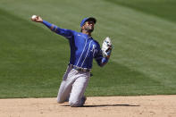 Kansas City Royals third baseman Kelvin Gutierrez commits a throwing error on a base hit by Oakland Athletics' Stephen Piscotty that allowed Piscotty to reach second base and Sean Murphy to reach third base during the fifth inning of a baseball game in Oakland, Calif., Sunday, June 13, 2021. (AP Photo/Jeff Chiu)