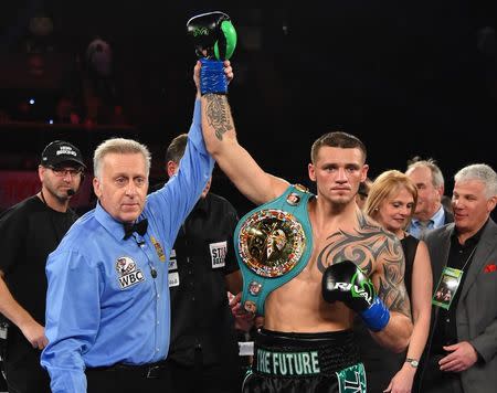 Dec 17, 2016; Los Angeles, CA, USA; Joe Smith Jr. in the has his arm raised after defeating Bernard Hopkins (not pictured) in their light heavyweight boxing fight at The Forum. Smith Jr. won with a TKO in round 7. Mandatory Credit: Jayne Kamin-Oncea-USA TODAY Sports