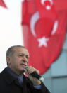 Turkish President Recep Tayyip Erdogan, delivers a speech at supporters in Istanbul, Sunday, Oct. 21, 2018. Erdogan says he will announce details of the Turkish investigation into the death of Saudi writer Jamal Khashoggi's on Tuesday, in a speech to ruling party members in parliament. (Presidential Press Service via AP, Pool)