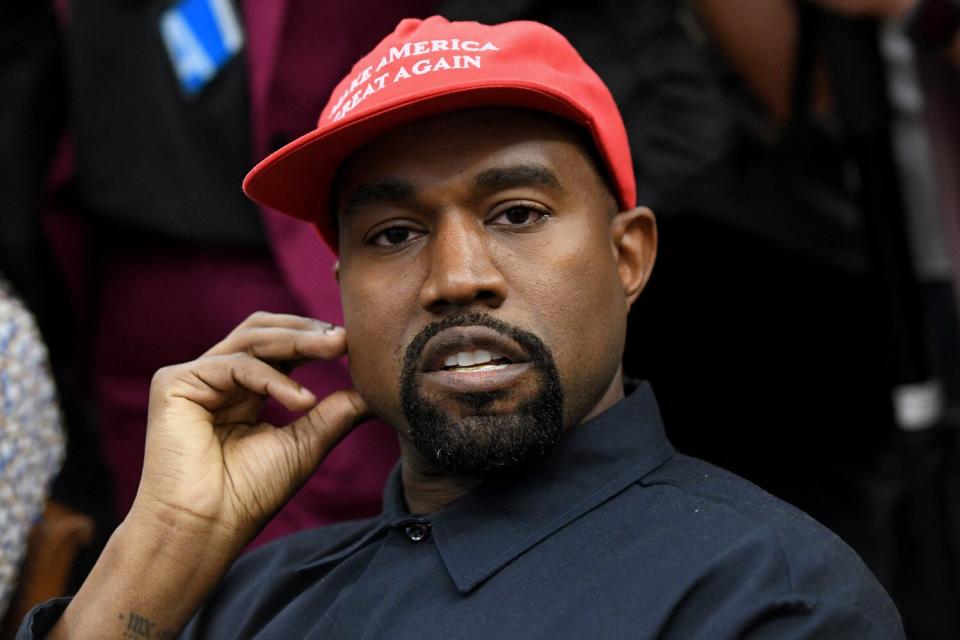 Kanye West looks on in the Oval Office of the White House during a meeting with President Trump