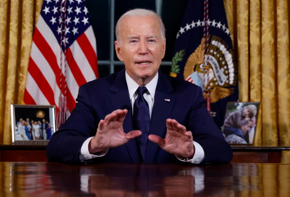 US President Joe Biden speaks from the Oval Office of the White House on Thursday in Washington about the wars in Israel and Ukraine (AP)