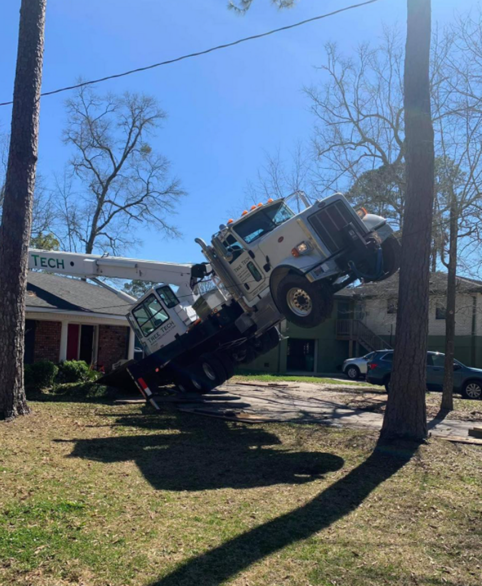 The truck sank into the ground after concrete broke underneath it, authorities said.