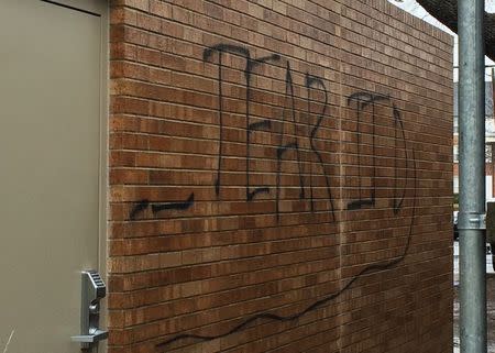 Graffiti is seen painted on the Sigma Alpha Epsilon fraternity at the University of Oklahoma in Norman, Oklahoma, March 9, 2015. REUTERS/Heide Brandes