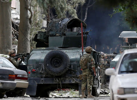 Afghan security forces take position as they fire during a gunmen attack in Kabul, Afghanistan May 8, 2019.REUTERS/Mohammad Ismail