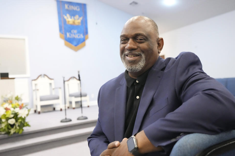 The Rev. Ricky Sutton sits in the nave of his Mount Carmel Ministries church during an interview in Pearl, Miss., Friday, Aug. 4, 2023. Six white former Mississippi law enforcement officers pled guilty Thursday to federal civil rights offenses against two Black men who were brutalized during a home raid that ended when an officer shot one of the men in the mouth. Sutton says racism runs so deep in Rankin County that some Black people are afraid to spend time there. (AP Photo/Rogelio V. Solis)