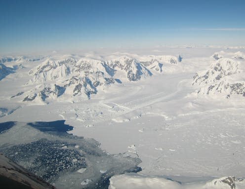 <span class="caption">Ice on the Antarctic peninsula flowing along a channel into an ice shelf in the ocean.</span> <span class="attribution"><span class="source">Hilmar Gudmundsson</span></span>