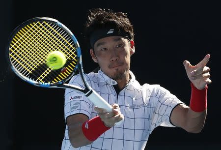 Tennis - Australian Open - Melbourne, Australia, January 17, 2018. Yuichi Sugita of Japan hits a shot against Ivo Karlovic of Croatia. REUTERS/Toru Hanai