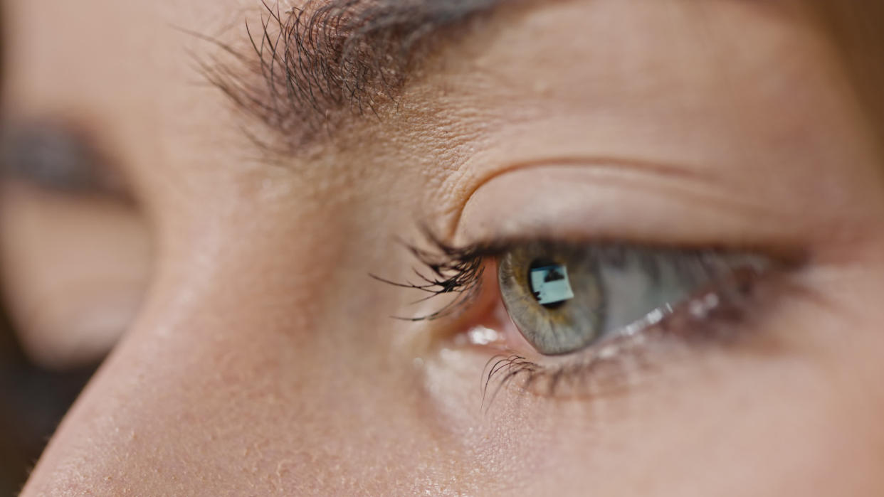 Macro of girl's eyes reading internet, with reflection of screen in her eye�. (Getty Images)