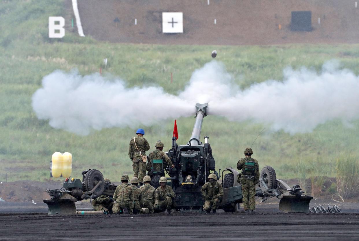 Japanese Ground Self-Defense Force fires a howitzer during an annual training