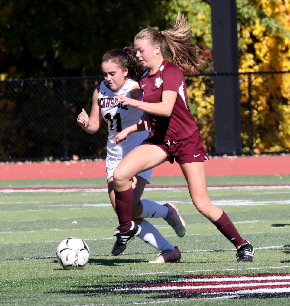 Scarsdale's Elahe Sherrell and Arlington's Riley Pettigrew chase down the ball during the Section One Class AA girls soccer championship at Nyack High School, Oct. 29, 2022. 