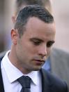 Oscar Pistorius leaves the high court in Pretoria, South Africa, Wednesday, May 14, 2014. The judge overseeing the murder trial of Pistorius on Wednesday ordered the double-amputee athlete to undergo psychiatric tests, meaning that the trial proceedings will be delayed. (AP Photo/Themba Hadebe)