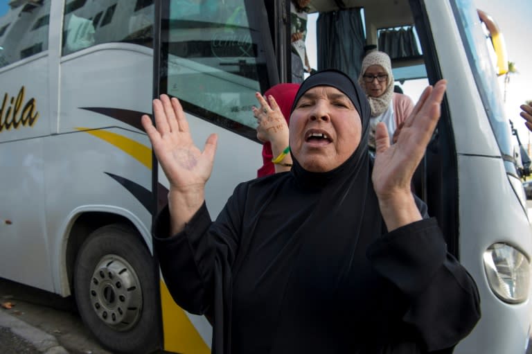 Families of jailed Moroccan protesters emerge from a bus in Casablanca after travelling to see their relatives