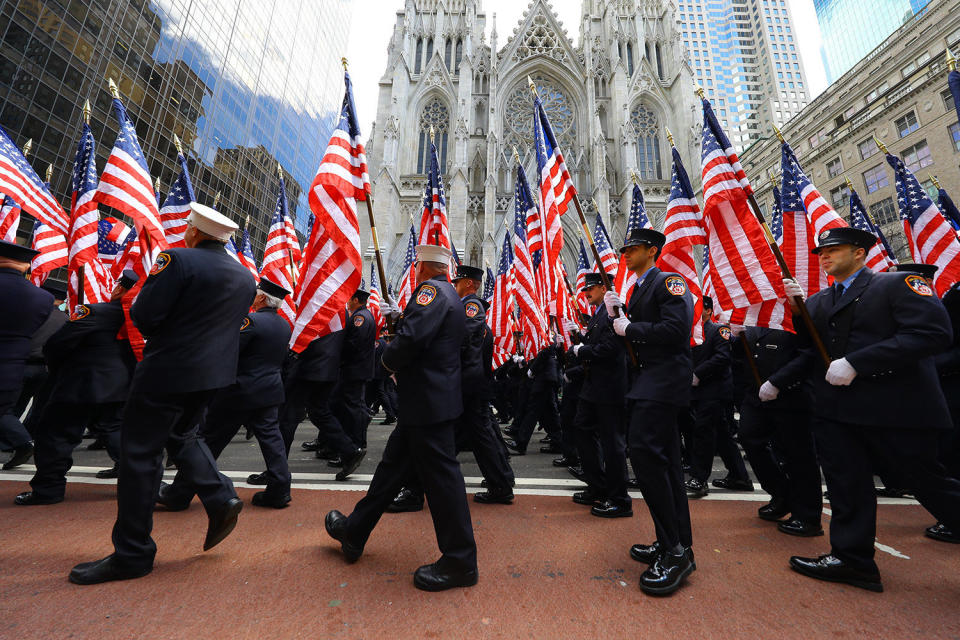 Members of the Fire Department Color Guard carry flags and march up Fifth Avenue during the St. Patrick's Day Parade in New York on March 16, 2019. (Photo: Gordon Donovan/Yahoo News)