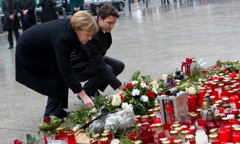 The German chancellor Angela Merkel and Canadian PM Justin Trudeau lay flowers in memory of victims of the Berlin truck attack.