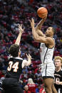 San Diego State forward Jaedon LeDee (13) shoots over Occidental forward Bernard Cassidy (34) during the first half of an NCAA college basketball game Friday, Dec. 2, 2022, in San Diego. (AP Photo/Denis Poroy)