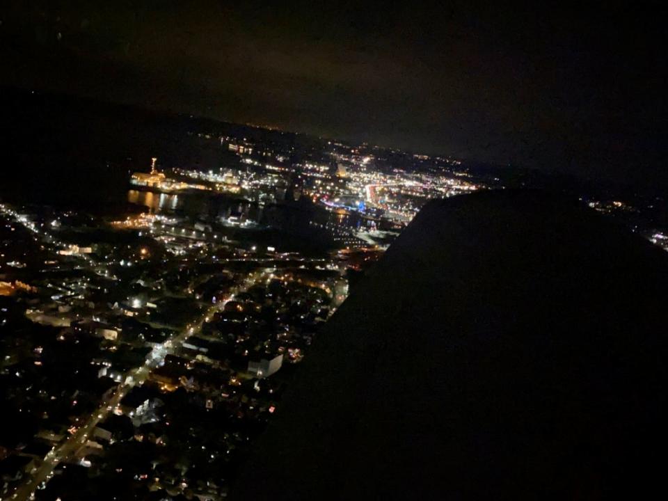 Flying over Connecticut in a small plane at night.