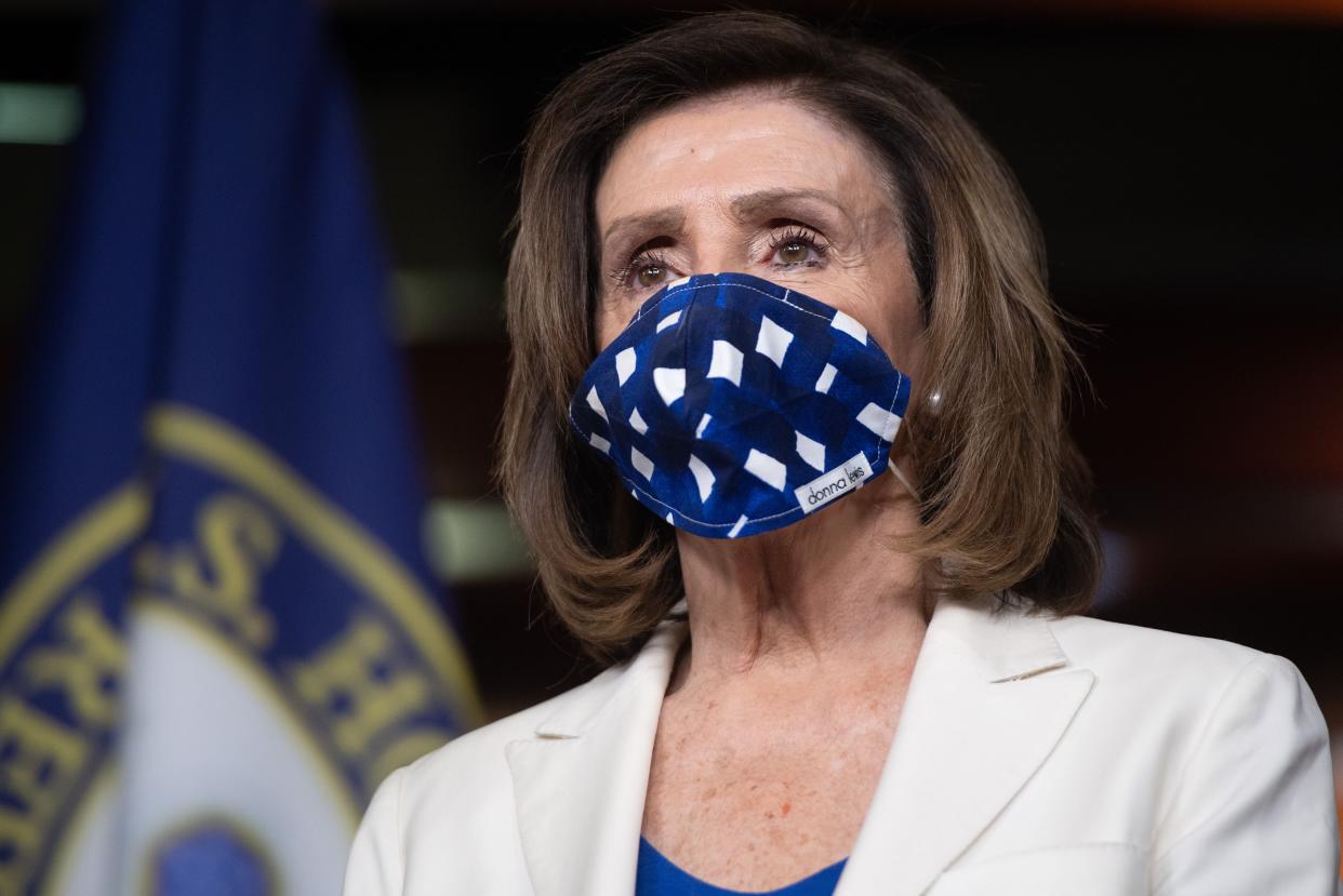 Speaker Nancy Pelosi wears a mask to protect herself and others from COVID-19 at her weekly press conference. (Photo: SAUL LOEB via Getty Images)