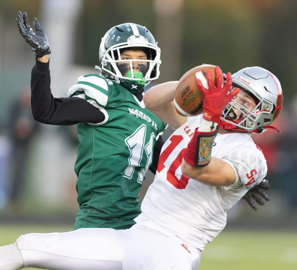 Sandy Valley receiver Chapin Greer catches a first-half pass defended by Malvern's Rodney Smith, Friday, Sept. 15, 2023.