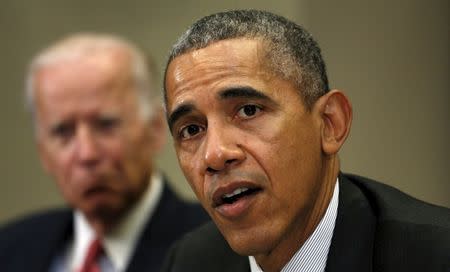 U.S. President Barack Obama speaks during a meeting with members of his national security team and cybersecurity advisors on new actions to enhance the nation's cybersecurity, including measures that are outlined in the President's FY2017 Budget proposal at the White House in Washington February 9, 2016. At left is Vice President Joe Biden. REUTERS/Kevin Lamarque