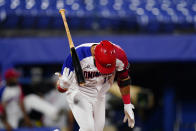 Dominican Republic's Jose Bautista tosses his bat after hitting a game winning RBI single during a baseball game against Israel at the 2020 Summer Olympics, Tuesday, Aug. 3, 2021, in Yokohama, Japan. The Dominican Republic won 7-6. (AP Photo/Matt Slocum)