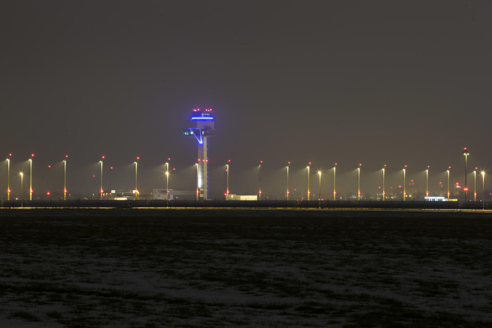 In this March 14, 2013 photo, the Berlin Brandenburg International Airport (BER) Willy-Brandt-Flughafen is seen partially illuminated in Schoenefeld near Berlin. The airport, also known as Willy Brandt International Airport, named for Germany's famed Cold War leader, was supposed to have been up and running in late 2011, a sign of Berlin's transformation from Cold War confrontation line to world class capital of Europe's economic powerhouse. Instead it has become a symbol of how, even for this technological titan, things can go horribly wrong. After four publicly announced delays, officials acknowledged the airport won't be ready by the latest target: October 2013. To spare themselves further embarrassment, officials have refused to set a new opening date. (AP Photo/Markus Schreiber)