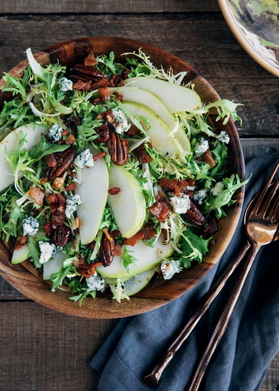 <p>Striped Spatula</p><p>This easy-to-prepare pear salad with homemade maple-bacon vinaigrette is a beautiful dish to serve for lunch or as a first course during the fall and winter months. </p><p><strong>Get the recipe: <a href="https://stripedspatula.com/pear-salad/" rel="nofollow noopener" target="_blank" data-ylk="slk:Pear and Blue Cheese Salad;elm:context_link;itc:0;sec:content-canvas" class="link ">Pear and Blue Cheese Salad</a></strong></p>