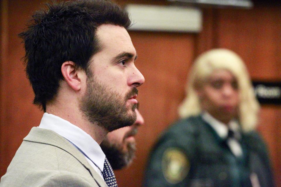 Mexican soap opera star Pablo Lyle, left, appears in court with his attorneys during his hearing, Wednesday, Jan. 22, 2020, in Miami. Florida Judge Marlene Fernandez-Karavetsos says that the Mexican actor won't be able to return to his native country while he awaits trial on a charge he fatally punched a man during a road-rage confrontation. (Carl Juste/Miami Herald via AP, Pool)