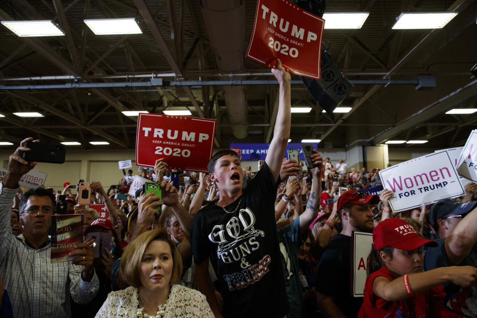 Supporters of President Donald Trump cheer as he arrives on stage at the Crown Expo for a campaign rally, Monday, Sept. 9, 2019, in Fayetteville, N.C. (AP Photo/Evan Vucci)