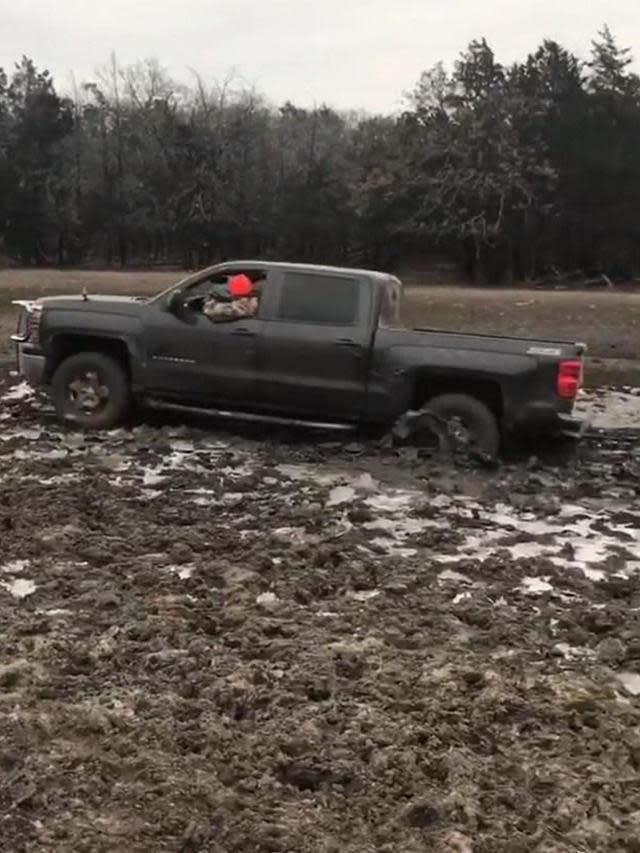 The country crooner had to call for assistance when his pickup truck got stuck in the mud.