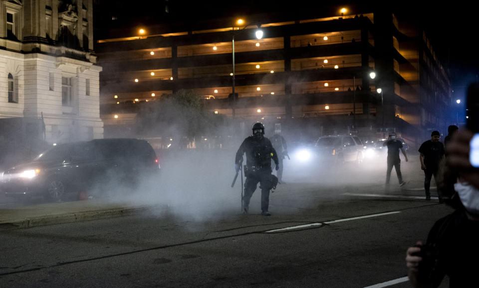 Detroit police clash with protesters into early Saturday morning during a rally calling for an end to police violence and justice for George Floyd Friday May 29, 2020. (Nicole Hester/Ann Arbor News via AP)