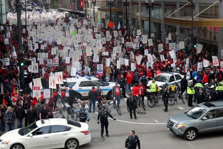 Teachers protest during a rally on the first day of a teacher strike in Chicago