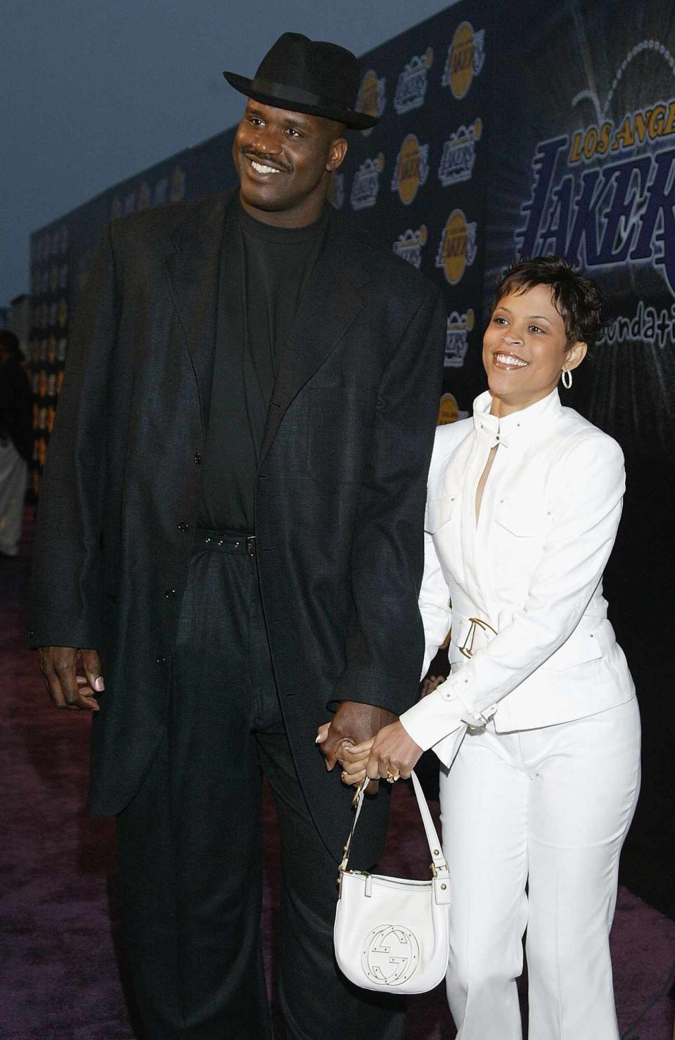 Shaquille O'Neal of the Los Angeles Lakers and wife Shaunie Nelson arrive for the 1st Annual Palms Casino Royale to benefit the Los Angeles Lakers Youth Foundation on April 8, 2004 at Barker Hanger, Santa Monica, California