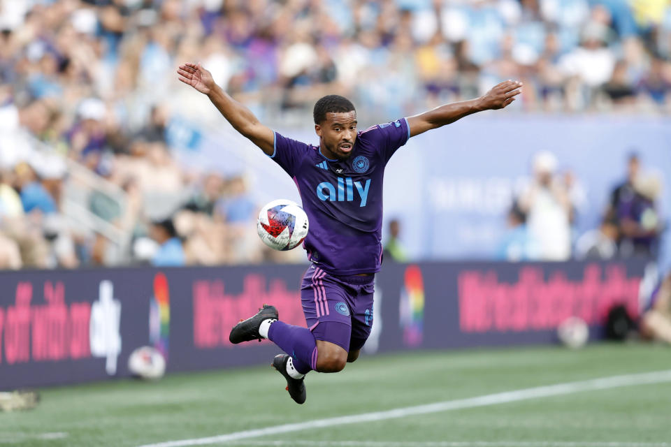 Charlotte FC defender Nathan Byrne (14) tries to control the ball in the air during an MLS soccer match against the Seattle Sounders, Saturday, June 10, 2023, in Charlotte, N.C. (AP Photo/Brian Westerholt)