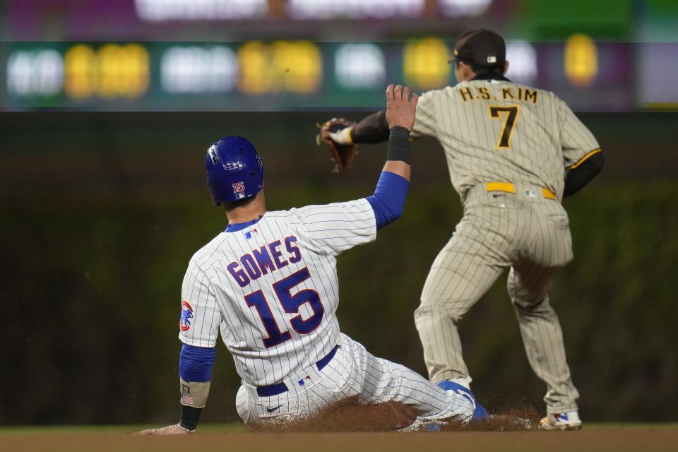 Chicago Cubs Yan Gomes is forced out by San Diego Padres second baseman Ha-Seong Kim during the sixth inning of a baseball game Tuesday, April 25, 2023, in Chicago. (AP Photo/Erin Hooley)