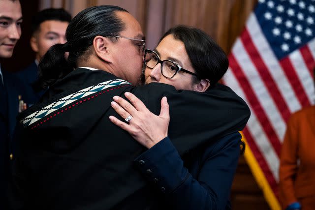 <p>Tom Williams/CQ-Roll Call, Inc via Getty</p> Eugene Peltola hugs wife Mary Peltola during her swearing-in ceremony on Sept. 13, 2022