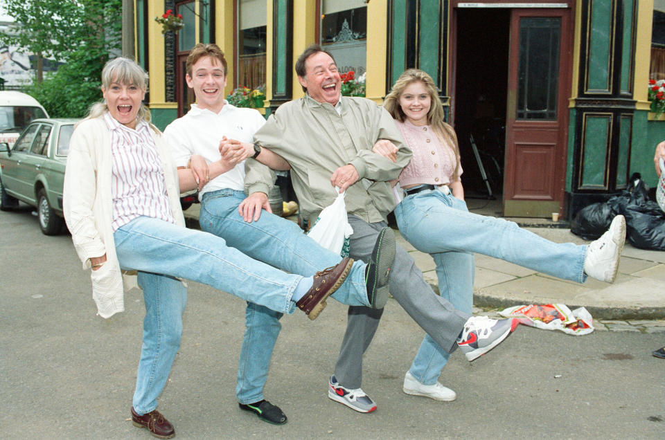 Wendy Richard, Adam Woodyatt, Bill Treacher and Daniella Westbrook as Sam Mitchell on the set of EastEnders, 1991. (Mirrorpix/Getty Images)