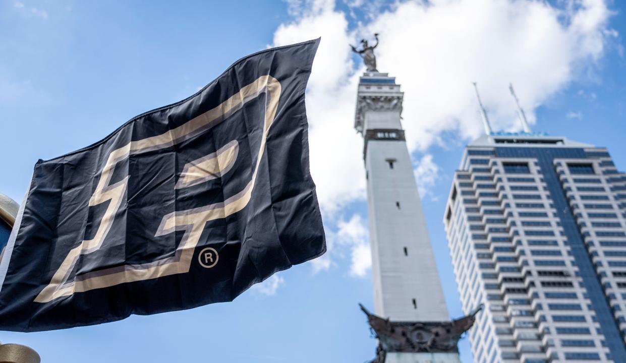 A Purdue University flag waves in Monument Circle on Thursday, June 27, 2024, at a Paint the Town Gold event celebrating the school's new stand-alone Indianapolis campus.