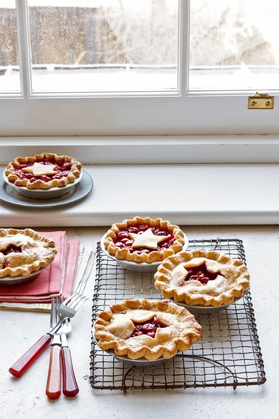 easy cherry pie in mini pie tins with star pie crust cut outs on top