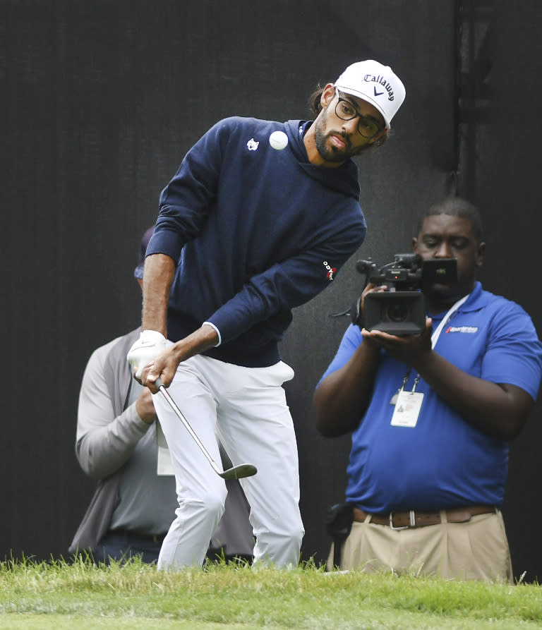 Akshay Bhatia hits out of the rough on the ninth hole during the second round of the Rocket Mortgage Classic golf tournament at the Detroit Golf Club in Detroit, Michigan, Friday, June 27, 2024. (Daniel Mears/Detroit News via AP)