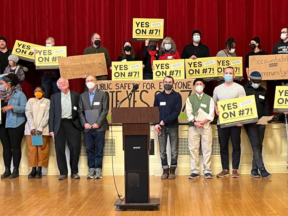 Ben Cohen and Jerry Greenfield, both to the left of the podium on the bottom row, spoke in support of the community control board on Feb. 22, 2023. Ben & Jerry's the company also supports the ballot item.