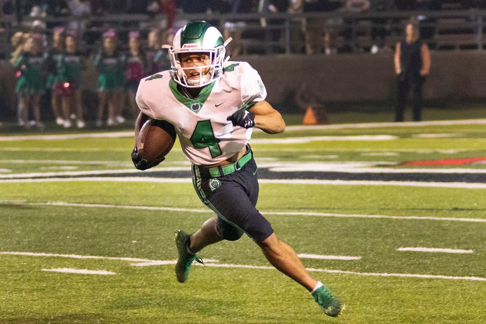 Rams Jason Calvin (4) looks for a hole for yardage during Fridays game against the St. Maryâ€™s Rams at Alex G. Spanos Stadium. Dianne Rose/For The Record